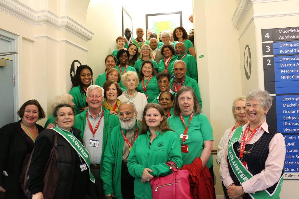 Some of our Volunteers in their green jackets/tops at Moorfields Eye Hospital