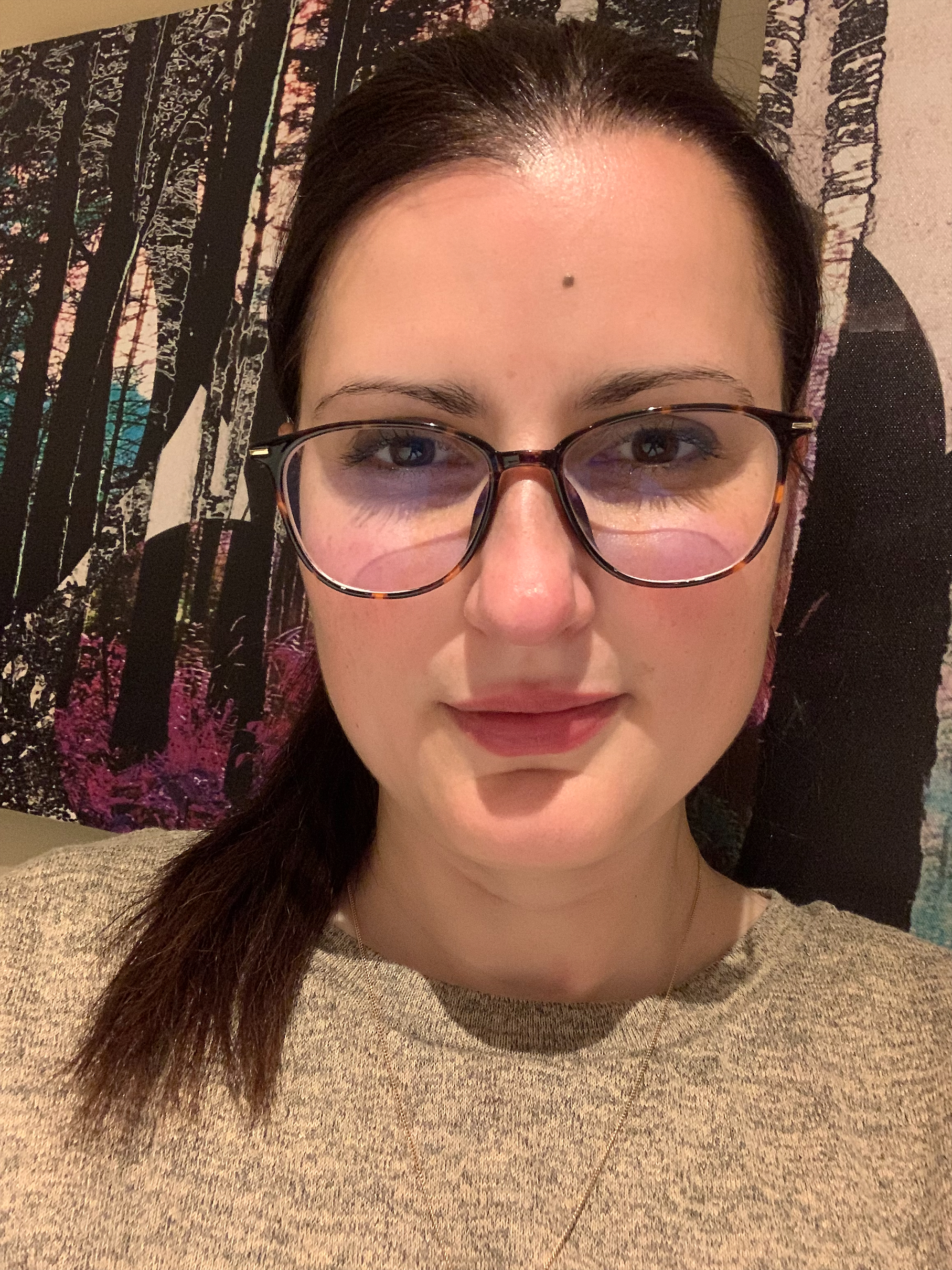A photograph of Julia's face and shoulders as she looks into the camera.