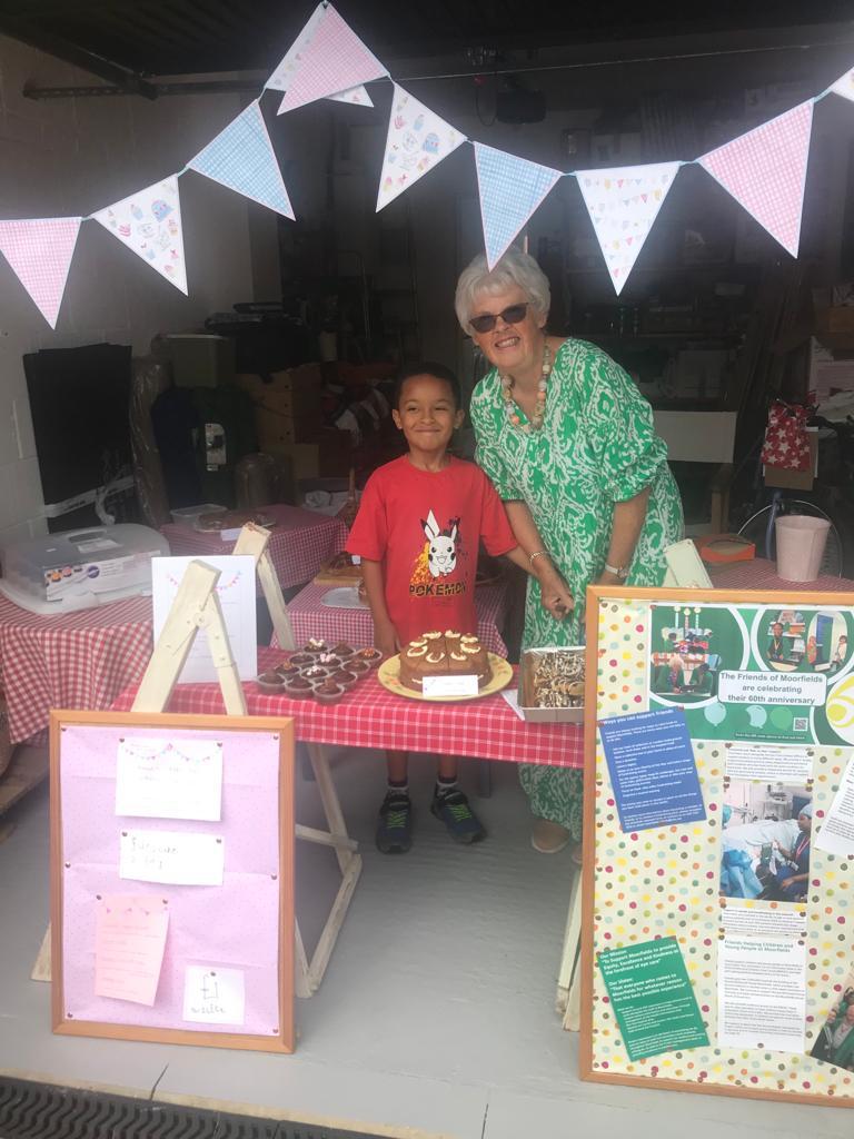 Sandra and Samuel pose at their cake stall.