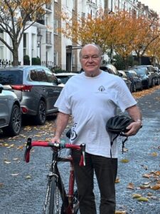 Michael poses with his bike, wearing a Friends of Moorfields t-shirt.