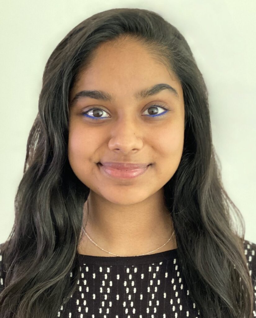 A head-and-shoulders image of Feeza smiling.