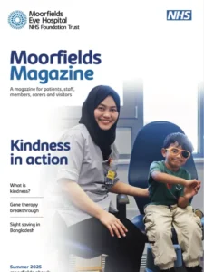 The front cover of Moorfields Magazine. It shows a smiling clinician with a young patient.